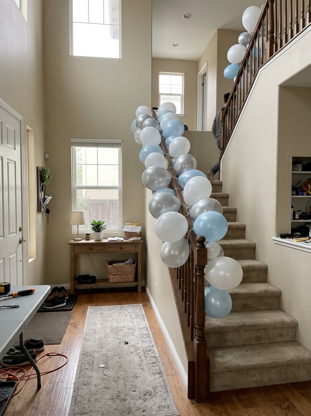 Balloon garland running down a staircase banister