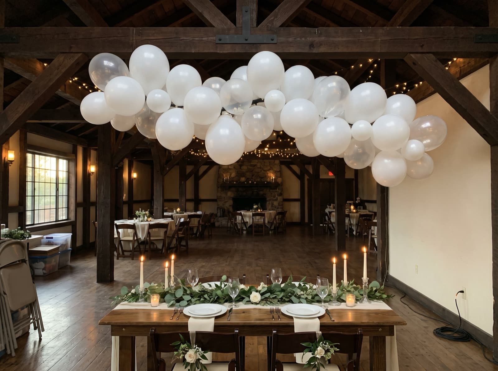 Balloon cloud over a sweetheart table