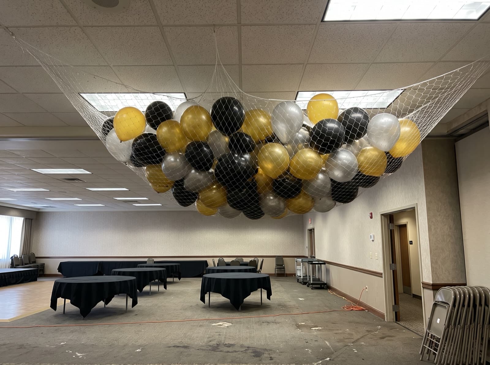 Balloon drop net overhead before a countdown